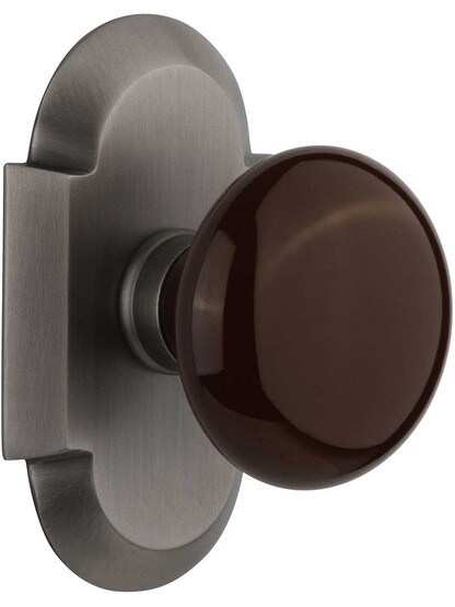 Arched Rosette Door Set with Brown Porcelain Knobs in Antique Pewter.